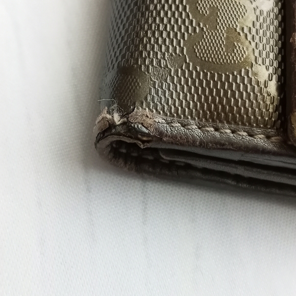 Authentic Gucci Metallic brown Signature wallet with GG charm - Picture 4 of 16